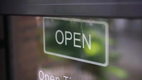 The store showcases a vibrant open sign that lights up during its operating Stock Footage 345186305