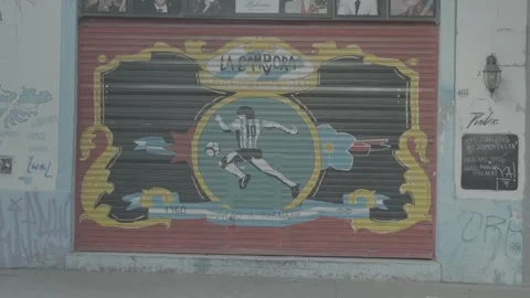 A store shutter with a football design in Buenos Aires, Argentina Stock Footage 345137555