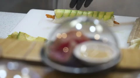 In-Store Sushi Restaurant Chef Slices Tempura Roll for Plating Stock Footage 340042731
