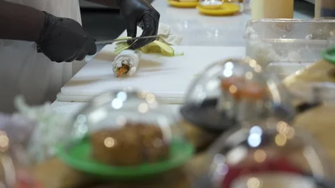 In-Store Sushi Restaurant Worker Slices Avocado Topped Roll Stock Footage 340042674