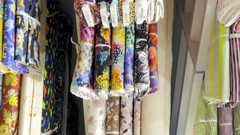 Store of textile colored fabric. Fabrics of different colors from different Video stock 250113110