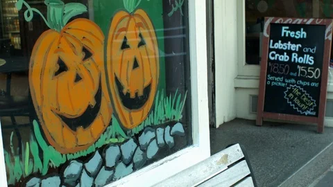 Store Window Painted With Large Pumpkins Halloween Fall October Fest 库存影片 116672119
