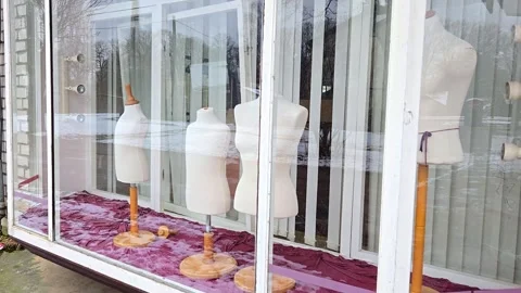 Storefront window display with mannequins in empty fashion boutique street Stock Footage 332761610