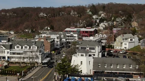 Storefronts and hillside homes in Port Jefferson village Stock-Footage 106401535