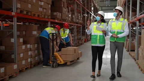 Storehouse employees using tablet for stocktaking Stock Footage 161950504