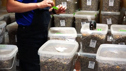 Storekeeper packs and seals a batch of amber for export Stock Footage 80662429