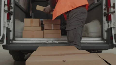 Storeman Putting Boxes for Shipment into Cargo Van Stock Footage 256066246