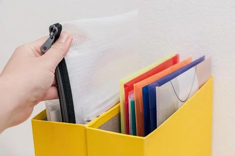 Storing organization system business documents in folders at workplace office Stock Photos