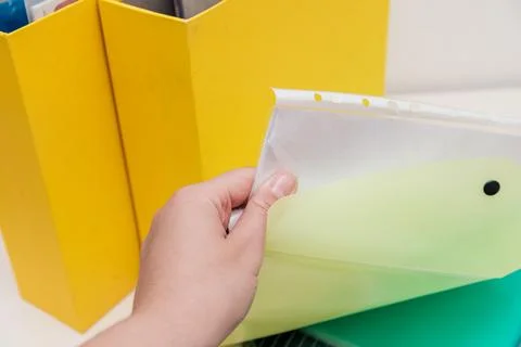 Storing organization system business documents in folders at workplace office Stock Photos
