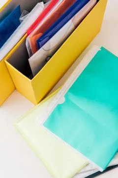 Storing organization system business documents in folders at workplace office Stock Photos