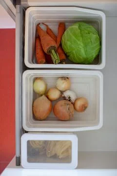 Storing vegetables in the kitchen. Stock Photos