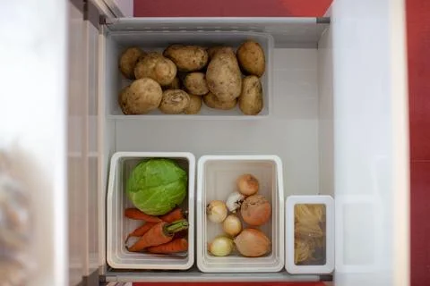 Storing vegetables in the kitchen. Stock Photos