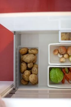 Storing vegetables in the kitchen. Stock Photos