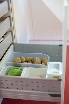 Storing vegetables in the kitchen. Stock Photos