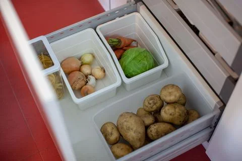 Storing vegetables in the kitchen. Stock Photos