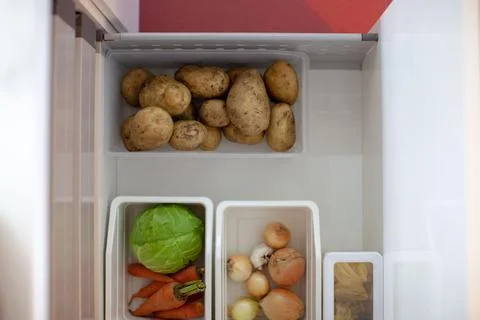 Storing vegetables in the kitchen. Stock Photos
