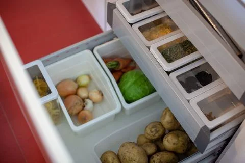 Storing vegetables in the kitchen. Stock Photos