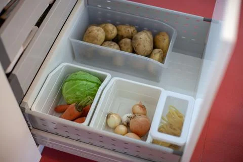 Storing vegetables in the kitchen. Stock Photos
