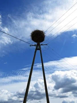 Stork Nest at a Background of Clouds on the Sky Stock Photos