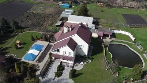 The storks have arrived. Aerial view of storks nest and country house. The plot 스톡 동영상 192664475