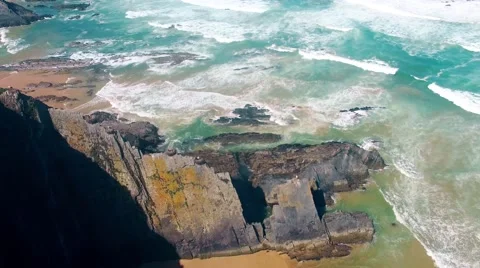 Storks nest on cliffs at the coast of Algarve Portugal aerial view Stock Footage 63782948