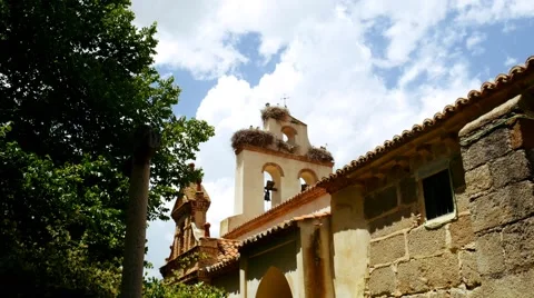 Storks nesting on a church in spring Stock Footage 65890173