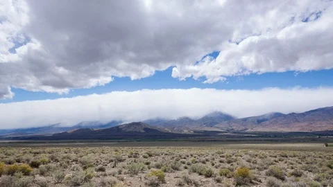 Storm and Clouds Building Over Mountains and Plains Video stock 90065551
