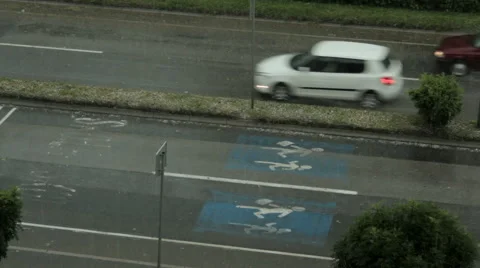 Storm and rain. Wind swallows trees. People and car run through the streets. Stock Footage 40062576