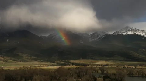 Storm and rainbow over the Absorka mountain range in Paradise Valley Stock Footage 60793618