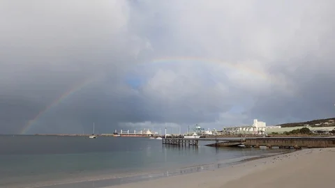 Storm and rainbow over calm ship port and boats in Australia Stock Footage 111892952