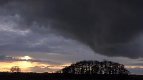 Storm approaching dark clouds over trees and England landscape 4K 스톡 동영상 86043600