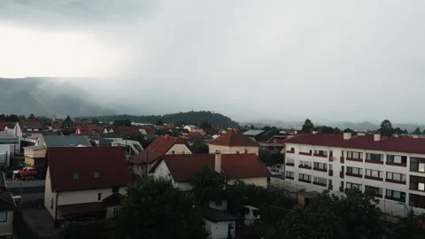 Storm Approaching Maribor Rooftops with Misty Hills Stockbeeldmateriaal 339066353