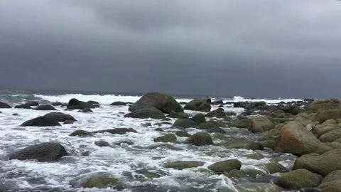 A storm approaching as waves roll in at Lista Video stock 124270900