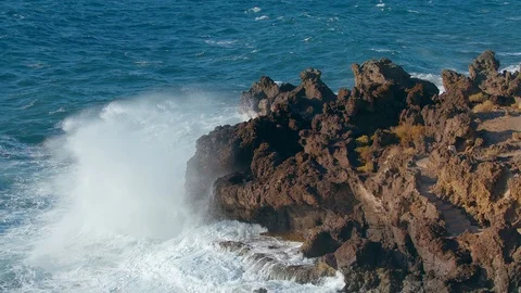 Storm in the Atlantic Ocean Waves Break the rocks of the shore Water Foam Video stock 125812568