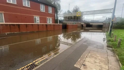 Storm Babet:  Dangerously deep flooded road in Derby city centre Stock Footage 253676382