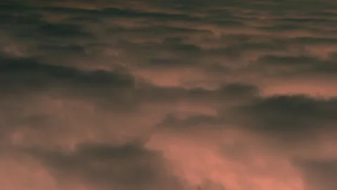 Storm Black Dark Gray Clouds and Orange Peach Evening Sky in Sunlight, Air Plane 库存影片 328506868