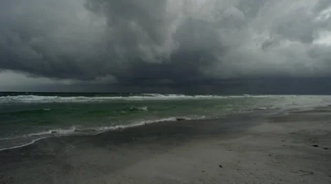 Storm Brewing over Sandy Beach with Quick Moving Clouds Stock Footage 39488094