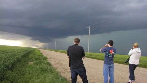 Storm chasers from NOAA use radar dishes to study the formation of vortexes in Stock Footage 123370777