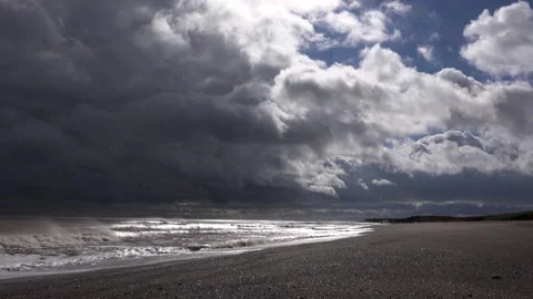 Storm cloads over coastal scene with waves and sunlight meditation Uk 4K Stock-Footage 172353818