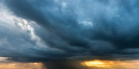 Storm cloud background during raining. Dark Clouds. Huge black clouds on dark Stock Photos
