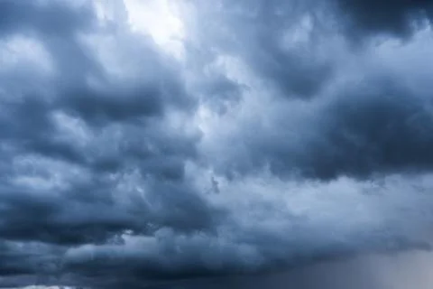 Storm cloud background during raining. Dark Clouds. Huge black clouds on dark Stock Photos