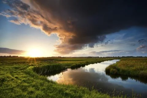 Storm cloud at dramatic sunset in summertime, Holland Stock Photos