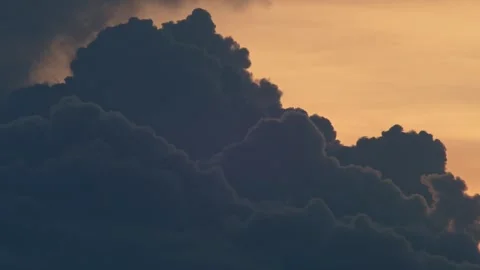 Storm Cloud Formation Backlit by Tropical Sunset Sky Stock-Footage 335801337