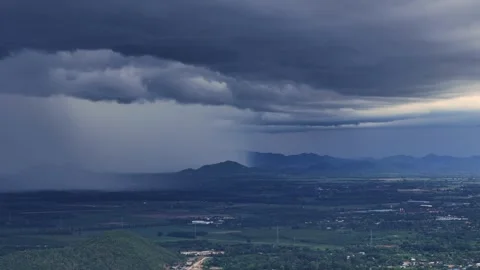Storm cloud formation during wet season casts shadow over rural mountain region Vídeo Stock 315225087
