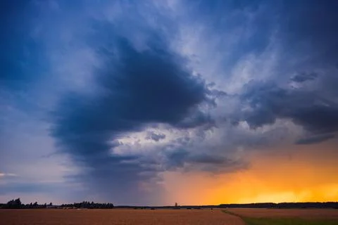 Storm cloud influenced by Climate change. Dangerous storm cloud spinning fast Stock Photos