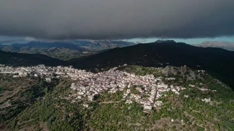 A storm cloud over a village in the mountains Stock Footage 231217148