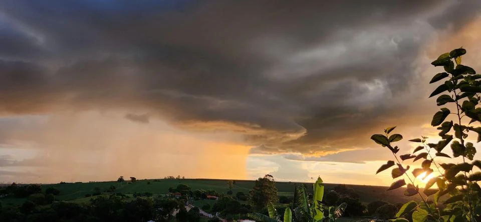 Storm cloud seen from afar Stock Photos