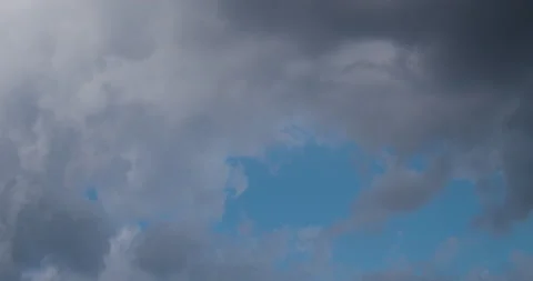 Storm cloud time lapse, blue to dark skies Stock Footage 134844772
