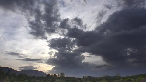 Storm clouds above countryside fields, mountain ridge - Plain Sky and Crop Land Stock Footage 339484999