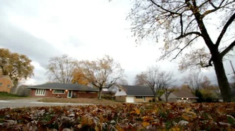Storm clouds above fall leaves in front yard 스톡 동영상 8997908